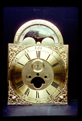 Unknown maker: Brass arched moon dial / Clockmaker: James Kirkham, Holywell